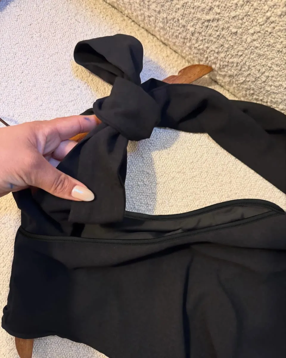 A Black One-Shoulder Halter-Neck Dress with a Bow Pleated and Fitted Short Dress Perfect for Everyday Outings and Attracting Attention a Sexy Little Black Dress for Dates